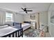 Bright bedroom with twin and full-size beds at 2307 Saxon Dr, New Smyrna Beach, FL 32169