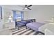 Well-lit bedroom with twin and full beds at 2307 Saxon Dr, New Smyrna Beach, FL 32169