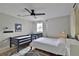 Cozy bedroom with twin and full-size beds at 2307 Saxon Dr, New Smyrna Beach, FL 32169