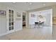 Bright dining area with built-in bench seating and view into kitchen at 2307 Saxon Dr, New Smyrna Beach, FL 32169