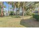 Large backyard with tropical landscaping and shed at 2515 Fairfax Ave, New Smyrna Beach, FL 32168