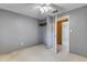 Bedroom with gray walls and mirrored closet doors at 2515 Fairfax Ave, New Smyrna Beach, FL 32168