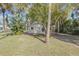 Front view of a house with a lush green lawn at 2515 Fairfax Ave, New Smyrna Beach, FL 32168