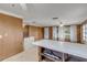 Kitchen with island and views into adjacent living area at 2515 Fairfax Ave, New Smyrna Beach, FL 32168