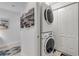 Convenient laundry closet with stackable washer/dryer at 263 Minorca Beach Way # 803, New Smyrna Beach, FL 32169