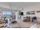 Spacious living area showcasing coastal decor, comfy seating, and ocean views at 263 Minorca Beach Way # 803, New Smyrna Beach, FL 32169