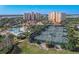 Aerial view of community tennis courts and pool at 265 Minorca Beach Way # 204, New Smyrna Beach, FL 32169