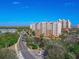 Aerial view of a luxury condo building with ocean views and resort-style amenities at 265 Minorca Beach Way # 204, New Smyrna Beach, FL 32169