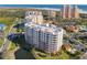 High-angle view of the condo buildings surrounded by water features and manicured grounds at 265 Minorca Beach Way # 204, New Smyrna Beach, FL 32169