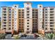 Condo building features well-maintained grounds, covered parking, and exquisite architectural details at 265 Minorca Beach Way # 204, New Smyrna Beach, FL 32169