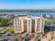Elegant condo building with private balconies, beautiful architecture, and lush landscaping at 265 Minorca Beach Way # 204, New Smyrna Beach, FL 32169