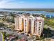 Exterior view of the condo building with an attached parking area at 265 Minorca Beach Way # 204, New Smyrna Beach, FL 32169