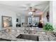 Granite countertops and stainless steel sink enhance this kitchen's appeal at 265 Minorca Beach Way # 204, New Smyrna Beach, FL 32169