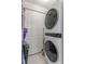 Convenient laundry room with stackable washer and dryer at 265 Minorca Beach Way # 204, New Smyrna Beach, FL 32169