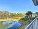 Enjoy serene pond views from the condo, with lush landscaping and nearby buildings visible at 265 Minorca Beach Way # 204, New Smyrna Beach, FL 32169