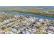 Wide aerial view of waterfront homes and properties along the canal at 275 Randle Ave, Oak Hill, FL 32759