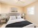 Bedroom with a queen bed and neutral color palette at 275 Randle Ave, Oak Hill, FL 32759