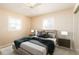 Bright bedroom with a comfy bed and window shutters at 275 Randle Ave, Oak Hill, FL 32759