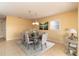 Formal dining room with six chairs and view into adjacent living area at 275 Randle Ave, Oak Hill, FL 32759