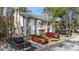 Exterior view of a multi-story apartment building surrounded by trees and a parking lot at 2910 Oak Trail Run # 10, Port Orange, FL 32127