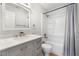 Updated bathroom features gray vanity with modern fixtures and a shower-tub combination at 2910 Oak Trail Run # 10, Port Orange, FL 32127