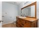 Bathroom features a classic wood vanity and a walk-in shower at 2910 Oak Trail Run # 10, Port Orange, FL 32127