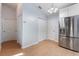 Bright kitchen area featuring stainless steel refrigerator and ample closet space at 2910 Oak Trail Run # 10, Port Orange, FL 32127