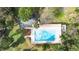 Aerial view of pool surrounded by lush greenery at 2910 Oak Trail Run # 10, Port Orange, FL 32127