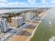 Aerial view of oceanfront highrise buildings and beach at 2967 S Atlantic Ave # 801, Daytona Beach Shores, FL 32118