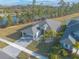 Aerial view of a house with a driveway and palm trees at 3012 Portofino Blvd, New Smyrna Beach, FL 32168