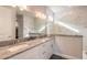 Elegant bathroom with double vanity, granite countertop, and a large shower at 3012 Portofino Blvd, New Smyrna Beach, FL 32168