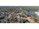 Aerial shot highlighting the property's location, situated near a river and lush greenery at 314 Hillman St, New Smyrna Beach, FL 32168