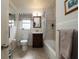 Clean bathroom featuring a shower-tub combo, vanity, and natural light from the window at 314 Hillman St, New Smyrna Beach, FL 32168