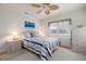 Bright bedroom featuring neutral colors, a comfortable bed, and natural light, perfect for relaxation at 314 Hillman St, New Smyrna Beach, FL 32168