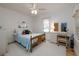 Cozy bedroom with a large window, creating a bright and airy atmosphere for rest and relaxation at 314 Hillman St, New Smyrna Beach, FL 32168