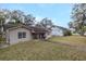 Charming single-story home features welcoming facade and well-manicured lawn at 314 Hillman St, New Smyrna Beach, FL 32168