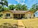 Charming single-story home with a well-maintained lawn and inviting walkway at 314 Hillman St, New Smyrna Beach, FL 32168