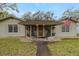 Inviting front porch with outdoor seating and a welcoming entrance at 314 Hillman St, New Smyrna Beach, FL 32168