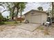 Detached garage with driveway, basketball hoop, and space for parking and outdoor activities at 314 Hillman St, New Smyrna Beach, FL 32168