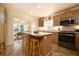 Well-lit kitchen with stainless steel appliances, ample countertop space, and a convenient breakfast bar at 314 Hillman St, New Smyrna Beach, FL 32168