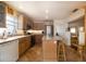 Functional kitchen featuring an island, stainless appliances, and tile flooring extending into the dining area at 314 Hillman St, New Smyrna Beach, FL 32168