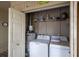 Convenient laundry area with washer, dryer, and storage shelves for efficient household chores at 314 Hillman St, New Smyrna Beach, FL 32168