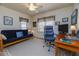 Dedicated office space with a comfortable seating area, desk, and natural light at 314 Hillman St, New Smyrna Beach, FL 32168