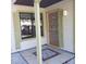 Charming front door with decorative glass and colorful mosaic tile on the entry porch at 322 Canal Rd # 16, Edgewater, FL 32132