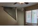 Hallway features window with blinds and stairway to second floor at 322 Canal Rd # 16, Edgewater, FL 32132