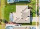 Top-down view of house, showcasing roofline and backyard pool at 323 Mariners Gate Dr, Edgewater, FL 32141