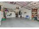 Organized garage with ample storage and ceiling fan at 323 Mariners Gate Dr, Edgewater, FL 32141