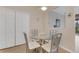 Bright kitchen nook with glass table and four chairs at 323 Mariners Gate Dr, Edgewater, FL 32141