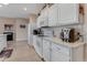 Well-equipped kitchen featuring white cabinets and modern appliances at 323 Mariners Gate Dr, Edgewater, FL 32141