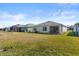 Spacious backyard with large grassy area at 3257 Carpentaria Dr, New Smyrna Beach, FL 32168